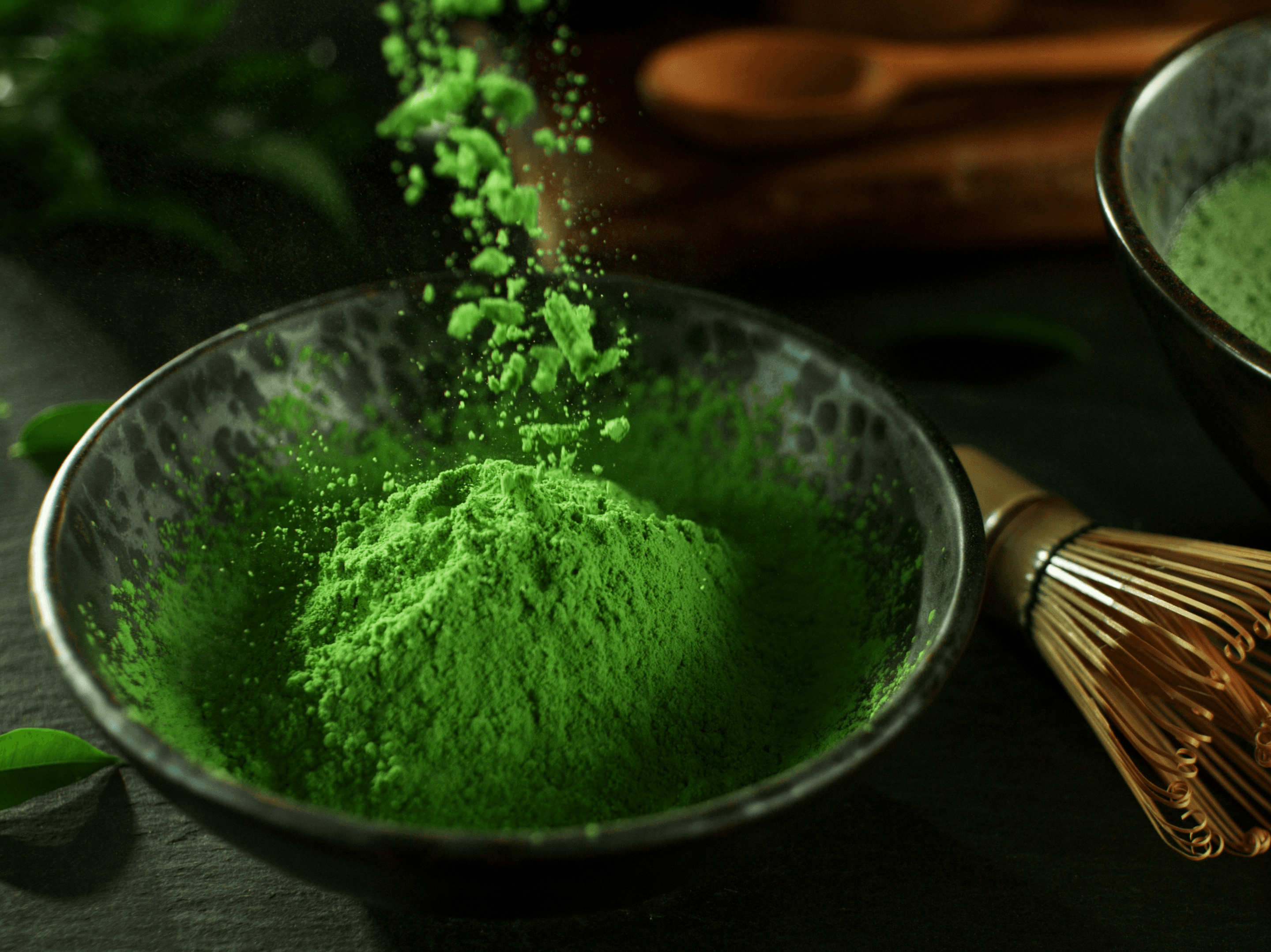 Premium Japanese matcha prepared in a bowl with a bamboo whisk